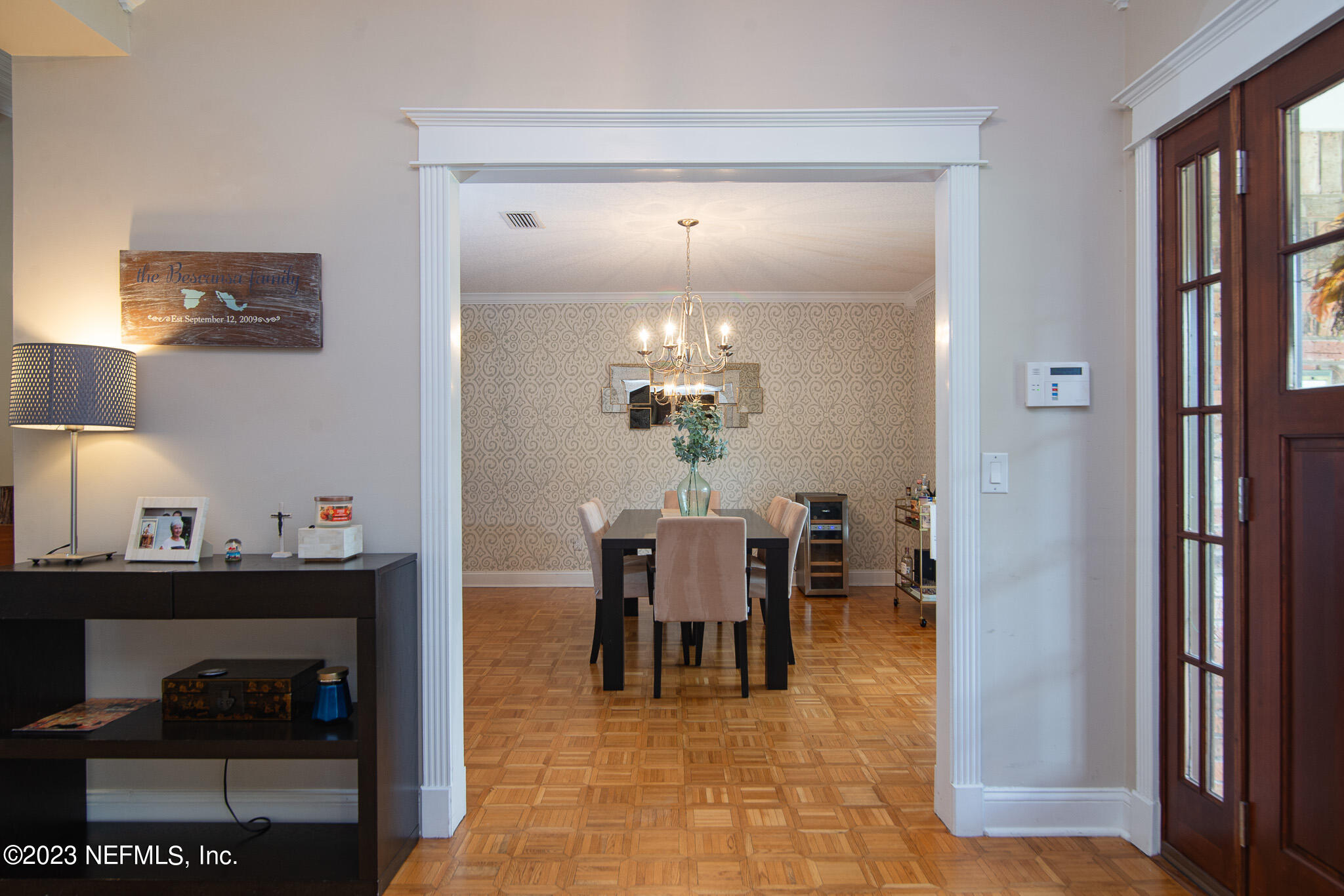 9409 Woodhaven Road Jacksonville, FL 32257 - Photo 5 of 38 a dining room filled with furniture and a mirror