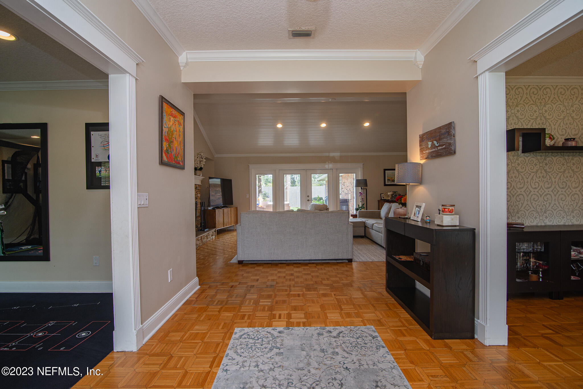 9409 Woodhaven Road Jacksonville, FL 32257 - Photo 7 of 38 a living room with stainless steel appliances kitchen island granite countertop furniture a rug and a window