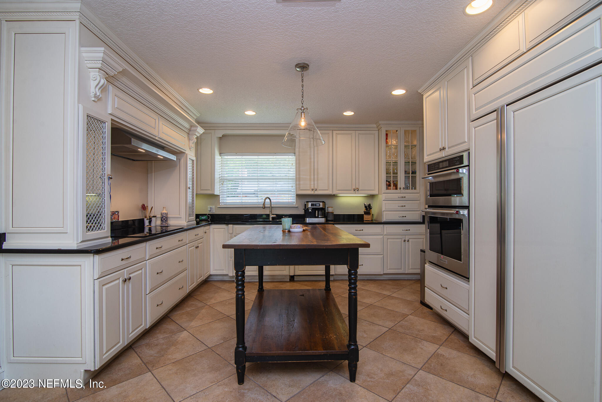 9409 Woodhaven Road Jacksonville, FL 32257 - Photo 10 of 38 a kitchen with stainless steel appliances granite countertop a refrigerator and a stove top oven