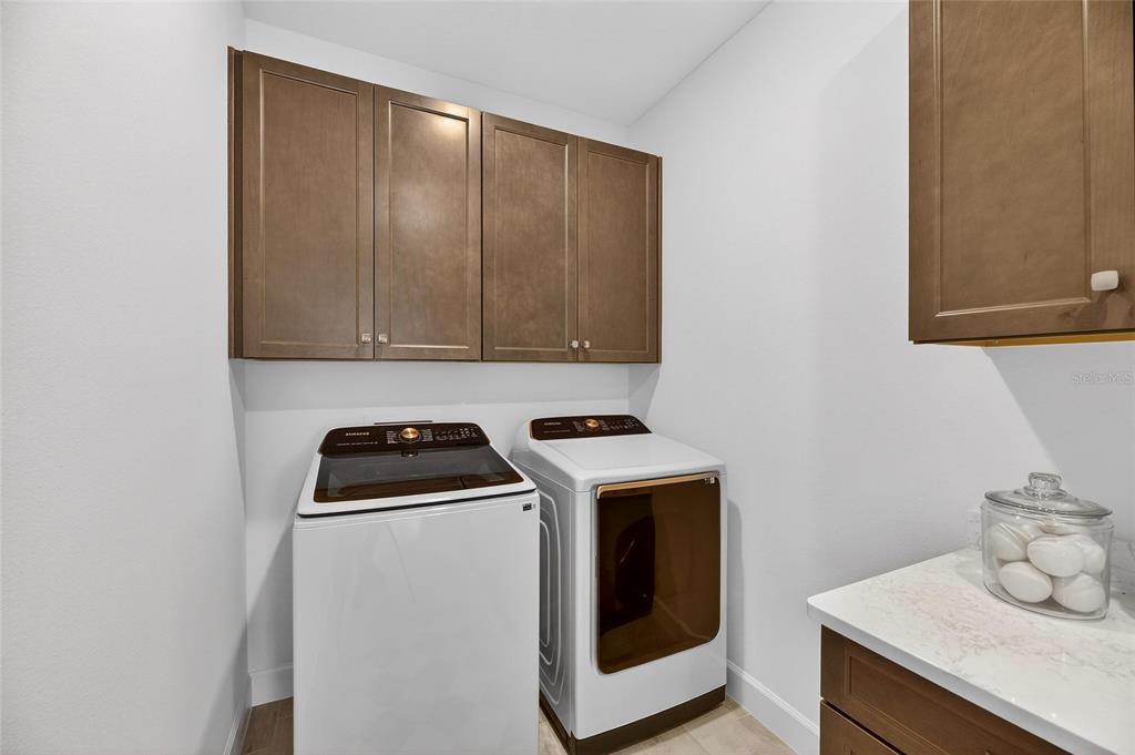 994 Signet Drive Apollo Beach, FL 33572 - Photo 52 of 98 a kitchen with a stove and a microwave