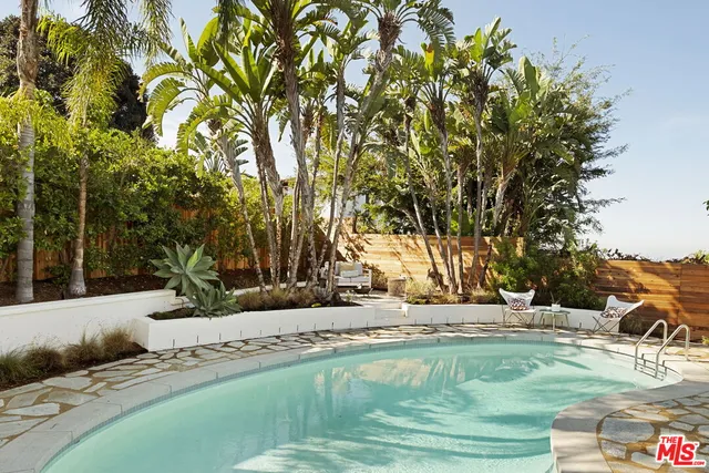 a view of swimming pool with a yard