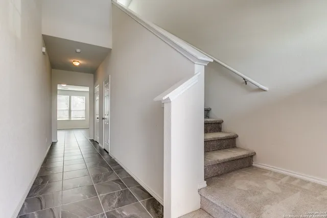 a view of entryway and hall with a window