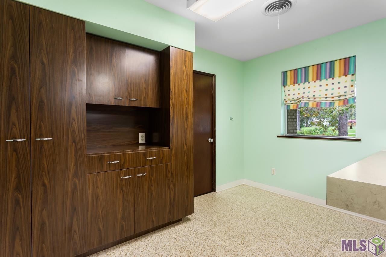 22475 Hoo Shoo Too Road Baton Rouge, LA 70817 - Photo 21 of 32 Custom Workstation with Space for a Microwave and Plenty of Extra Storage