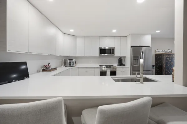 a bedroom with two beds and a couch