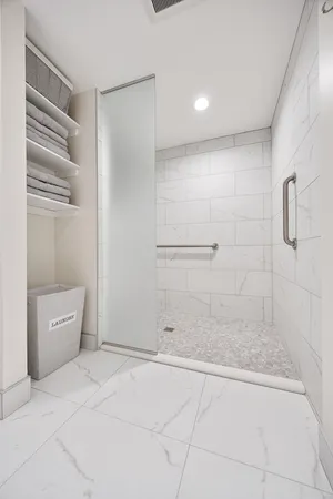 a utility room with sink dryer and washer