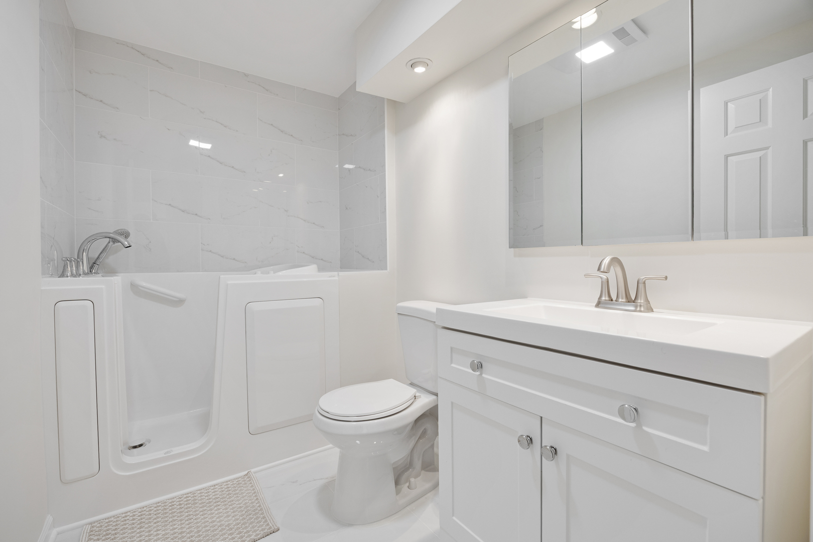 1401 Burr Oak Road, Unit 117B Hinsdale, IL 60521 - Photo 17 of 26 a bathroom with a sink a toilet and shower