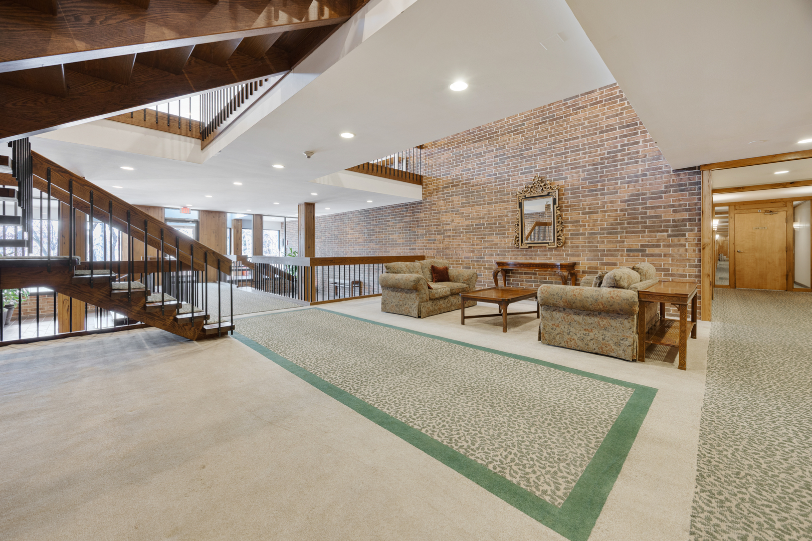 1401 Burr Oak Road, Unit 117B Hinsdale, IL 60521 - Photo 20 of 26 a living room with furniture and a rug