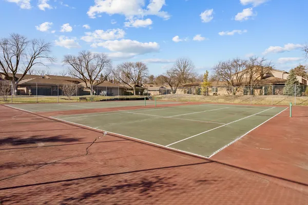 a view of street with parked cars