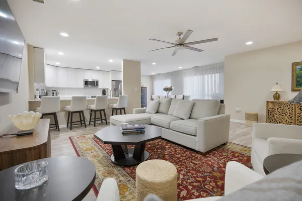a dining room with furniture and wooden floor