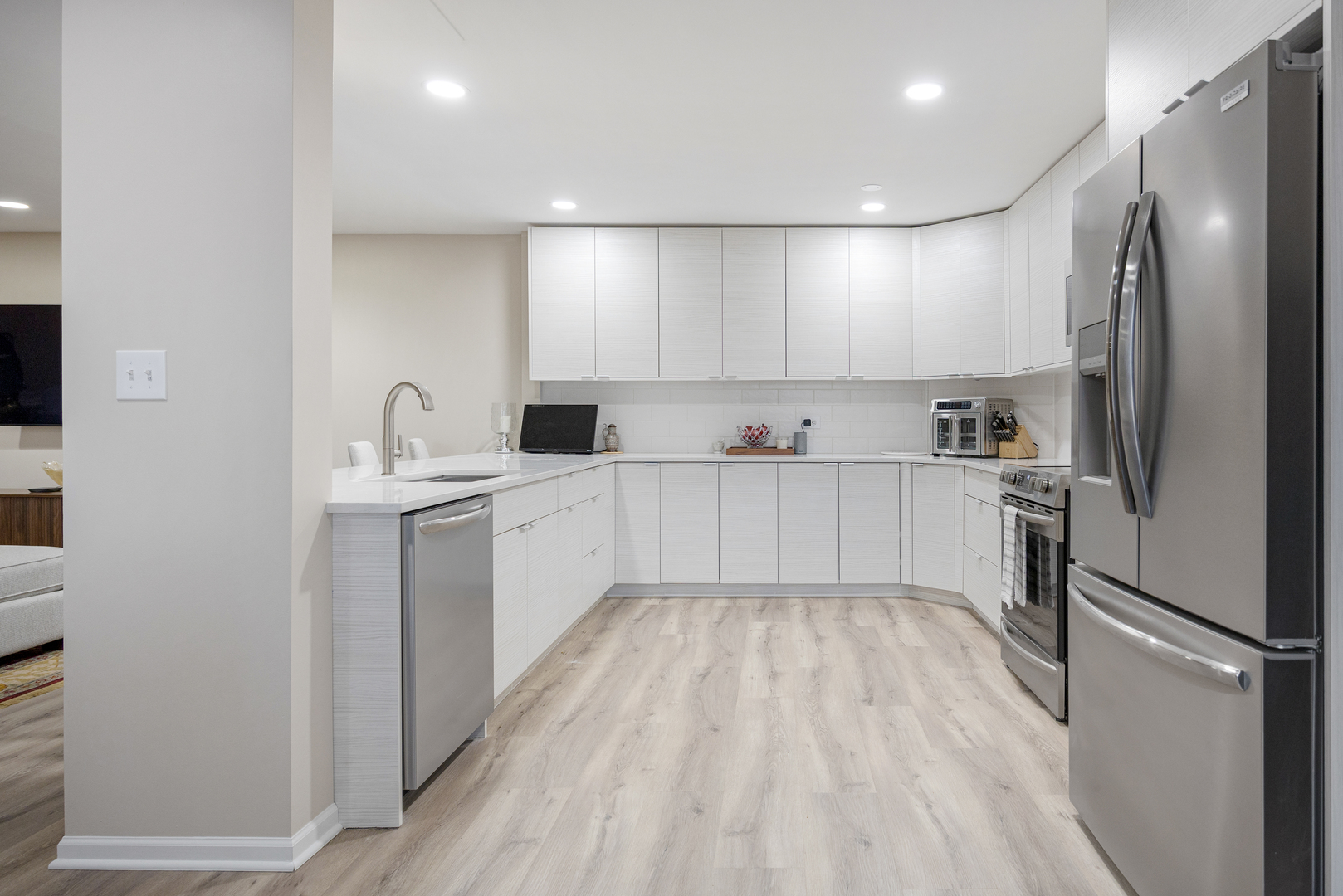 1401 Burr Oak Road, Unit 117B Hinsdale, IL 60521 - Photo 10 of 26 a kitchen with a sink stainless steel appliances and cabinets