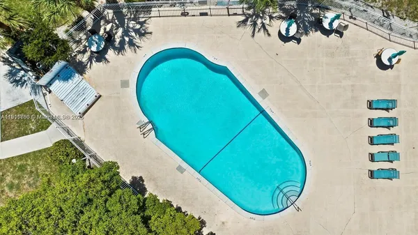 an aerial view of a house with swimming pool