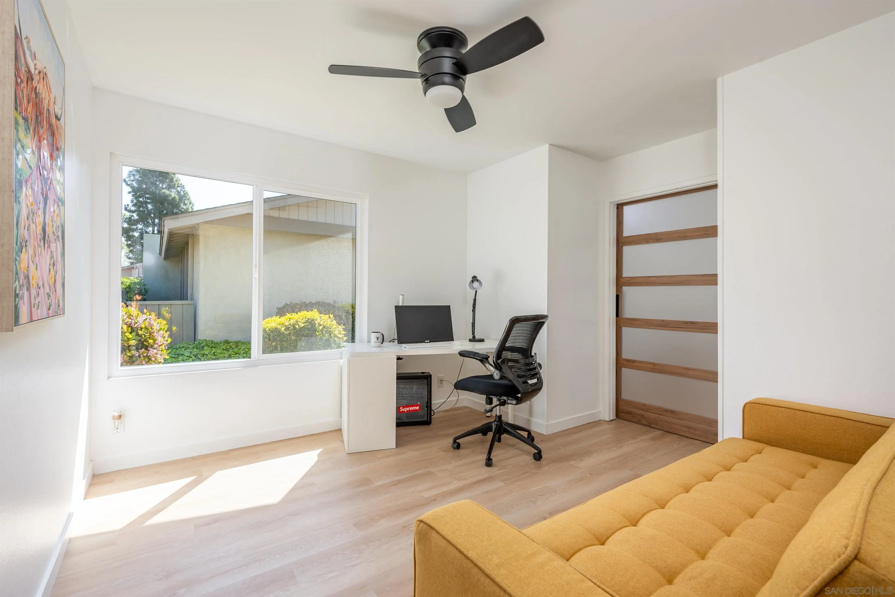 3577 Guava Way Oceanside, CA 92058 - Photo 11 of 42 a bedroom with furniture and a wooden floor