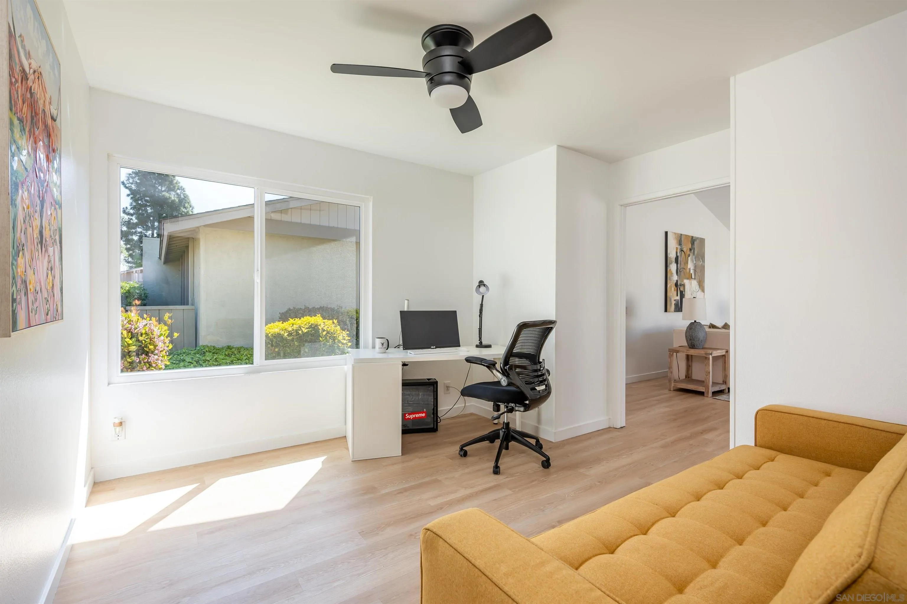 3577 Guava Way Oceanside, CA 92058 - Photo 12 of 42 a living room with furniture and a chandelier