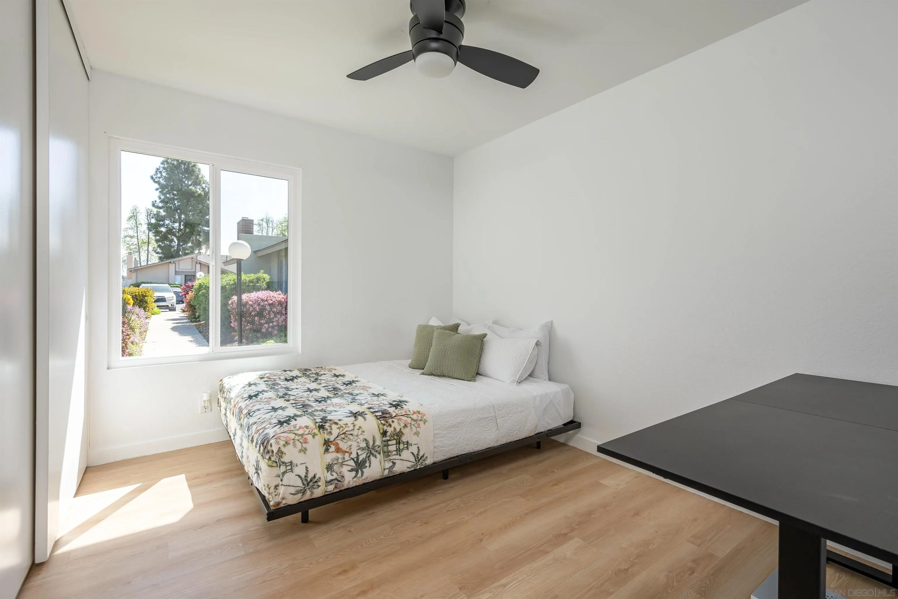 3577 Guava Way Oceanside, CA 92058 - Photo 20 of 42 a bedroom with a bed and a window