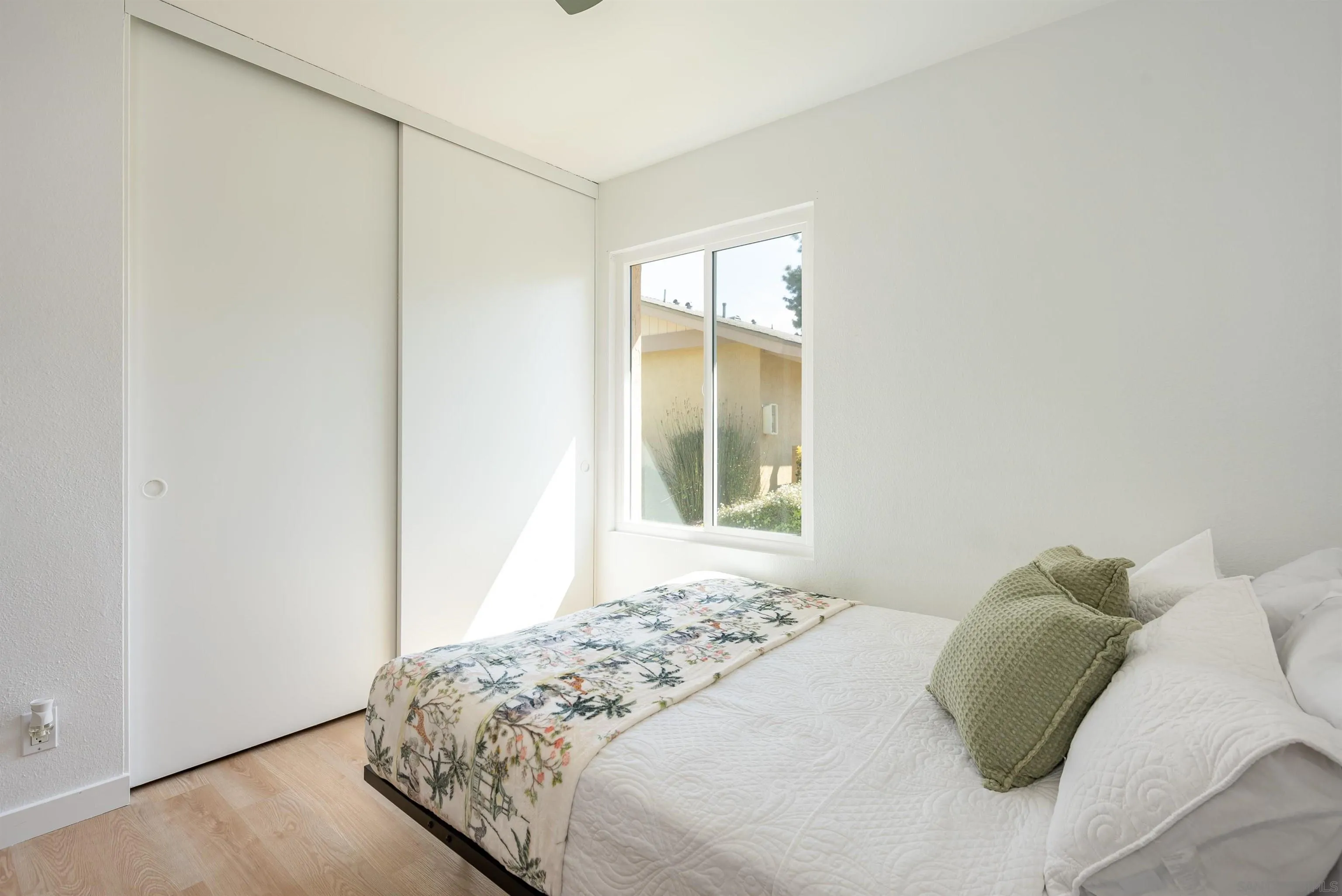 3577 Guava Way Oceanside, CA 92058 - Photo 21 of 42 a bedroom with a bed and a window