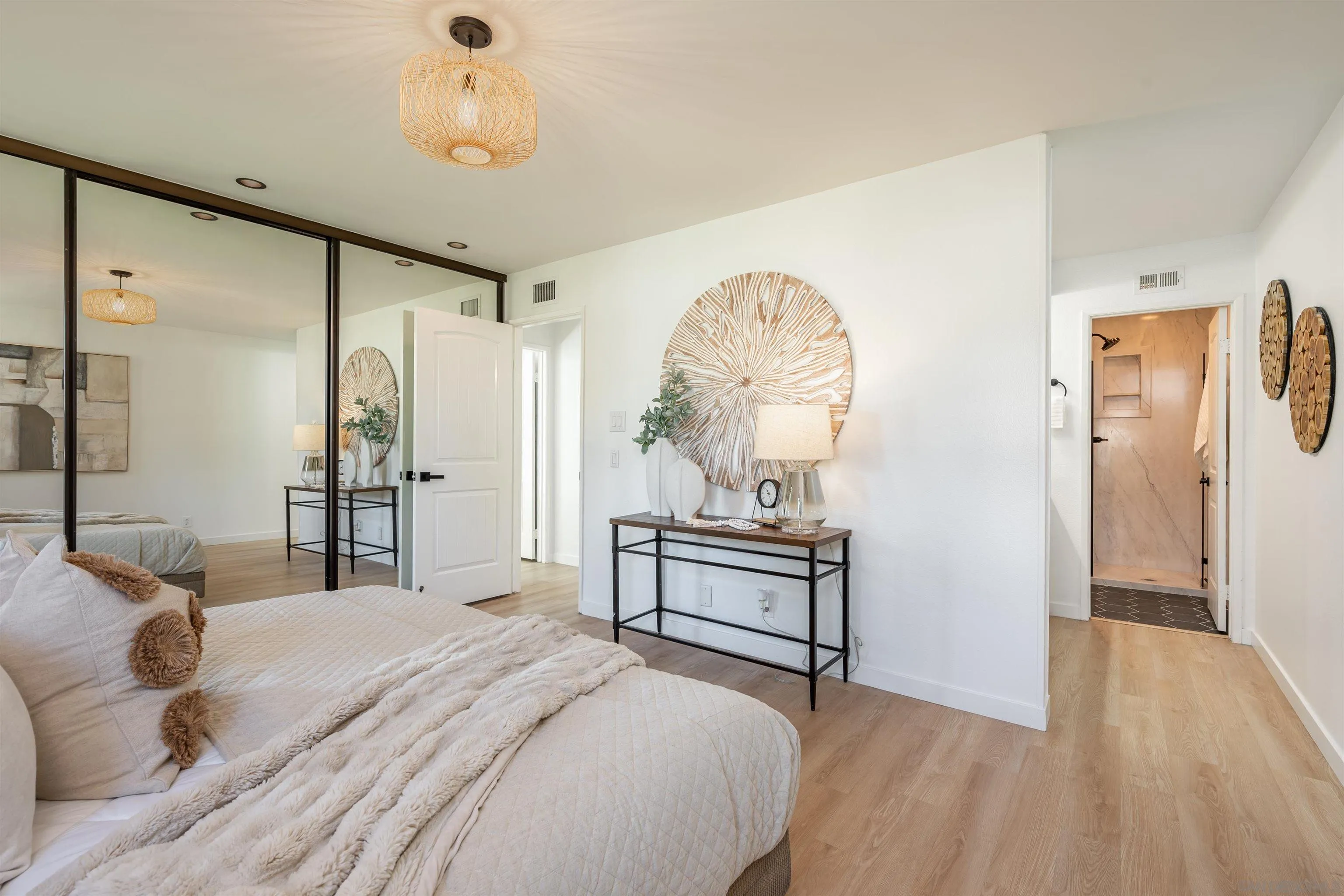 3577 Guava Way Oceanside, CA 92058 - Photo 28 of 42 a bedroom with a bed and a chandelier