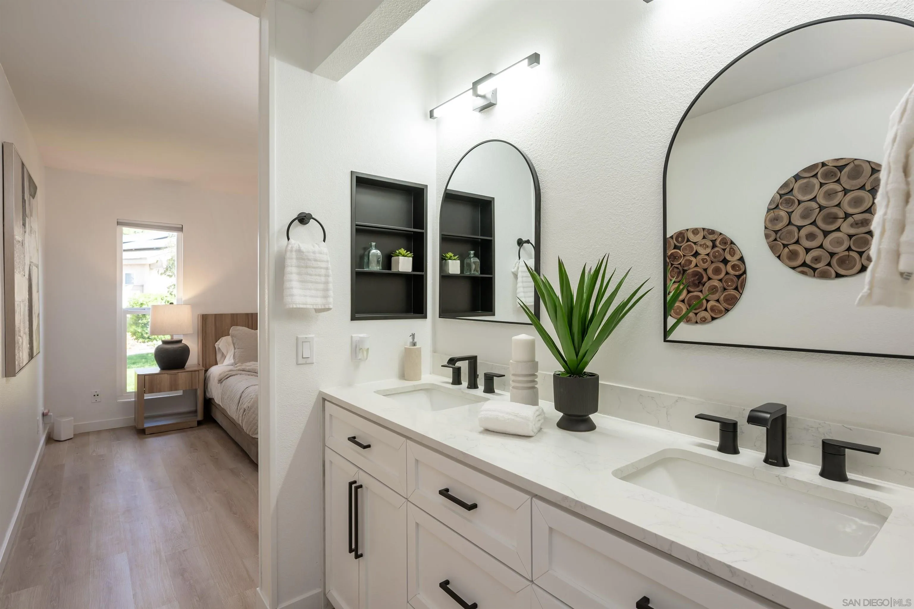 3577 Guava Way Oceanside, CA 92058 - Photo 31 of 42 a bathroom with a double vanity sink mirror and