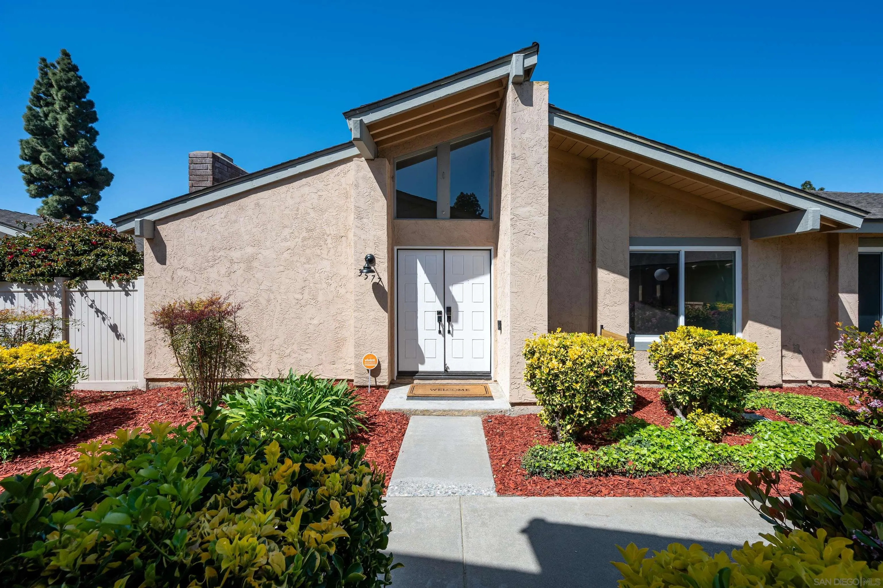 3577 Guava Way Oceanside, CA 92058 - Photo 36 of 42 a front view of a house with garden