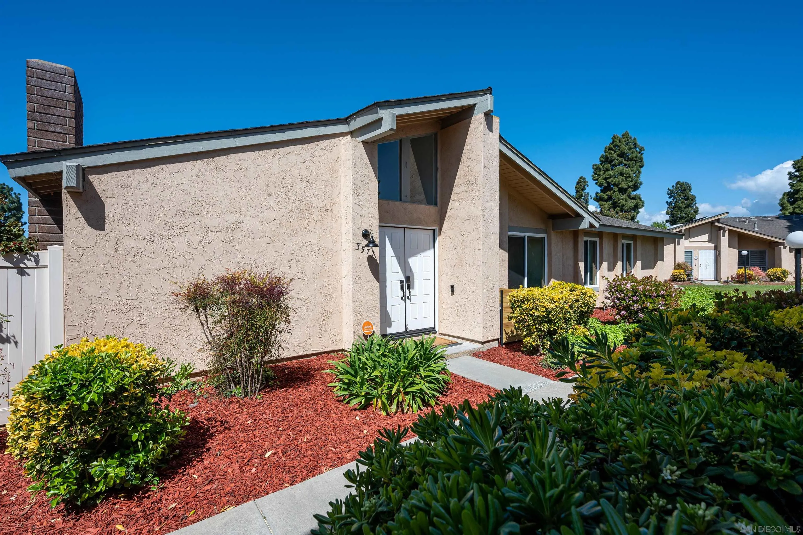 3577 Guava Way Oceanside, CA 92058 - Photo 38 of 42 a front view of a house with garden