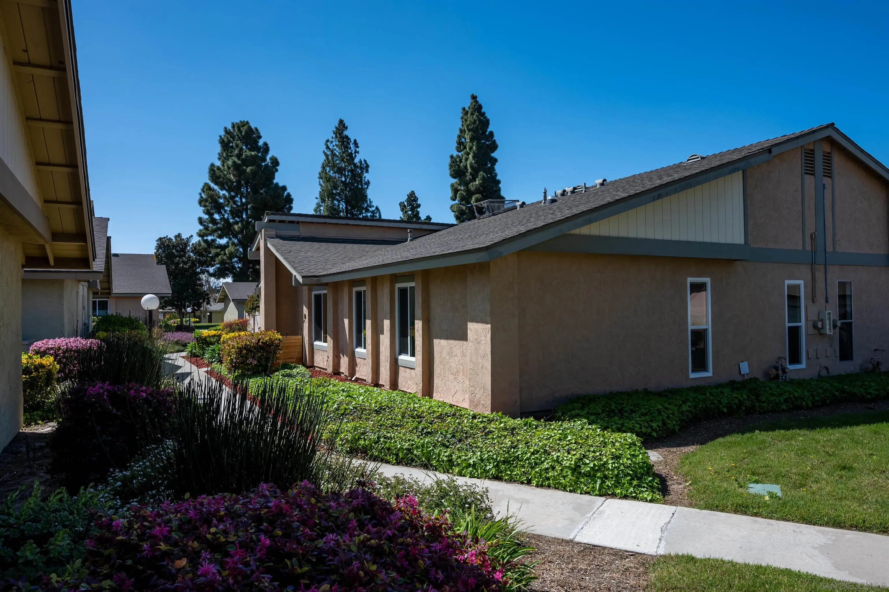 3577 Guava Way Oceanside, CA 92058 - Photo 40 of 42 a front view of a house with garden