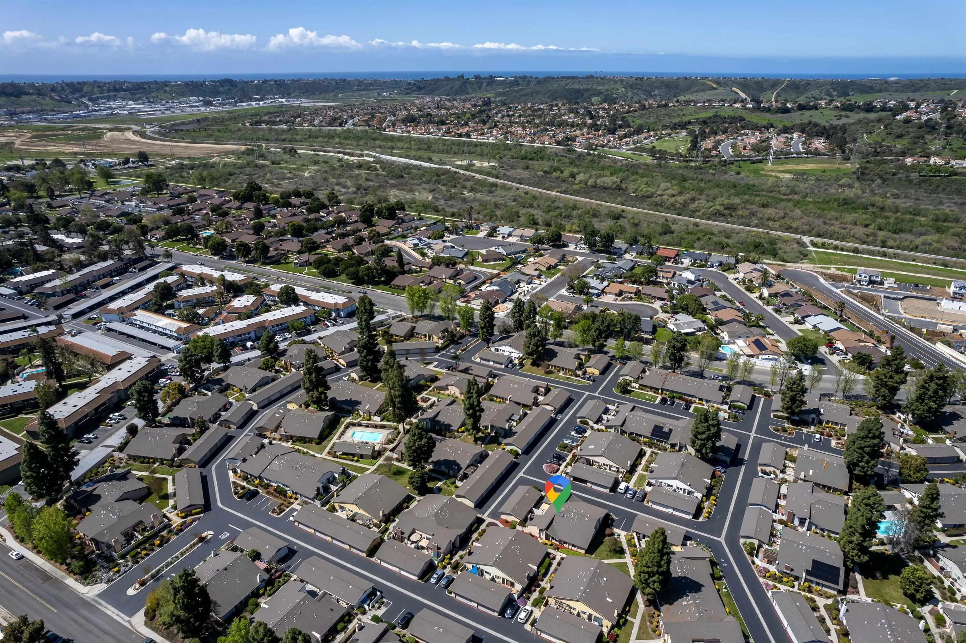 3577 Guava Way Oceanside, CA 92058 - Photo 42 of 42 an aerial view of a city with lots of residential buildings
