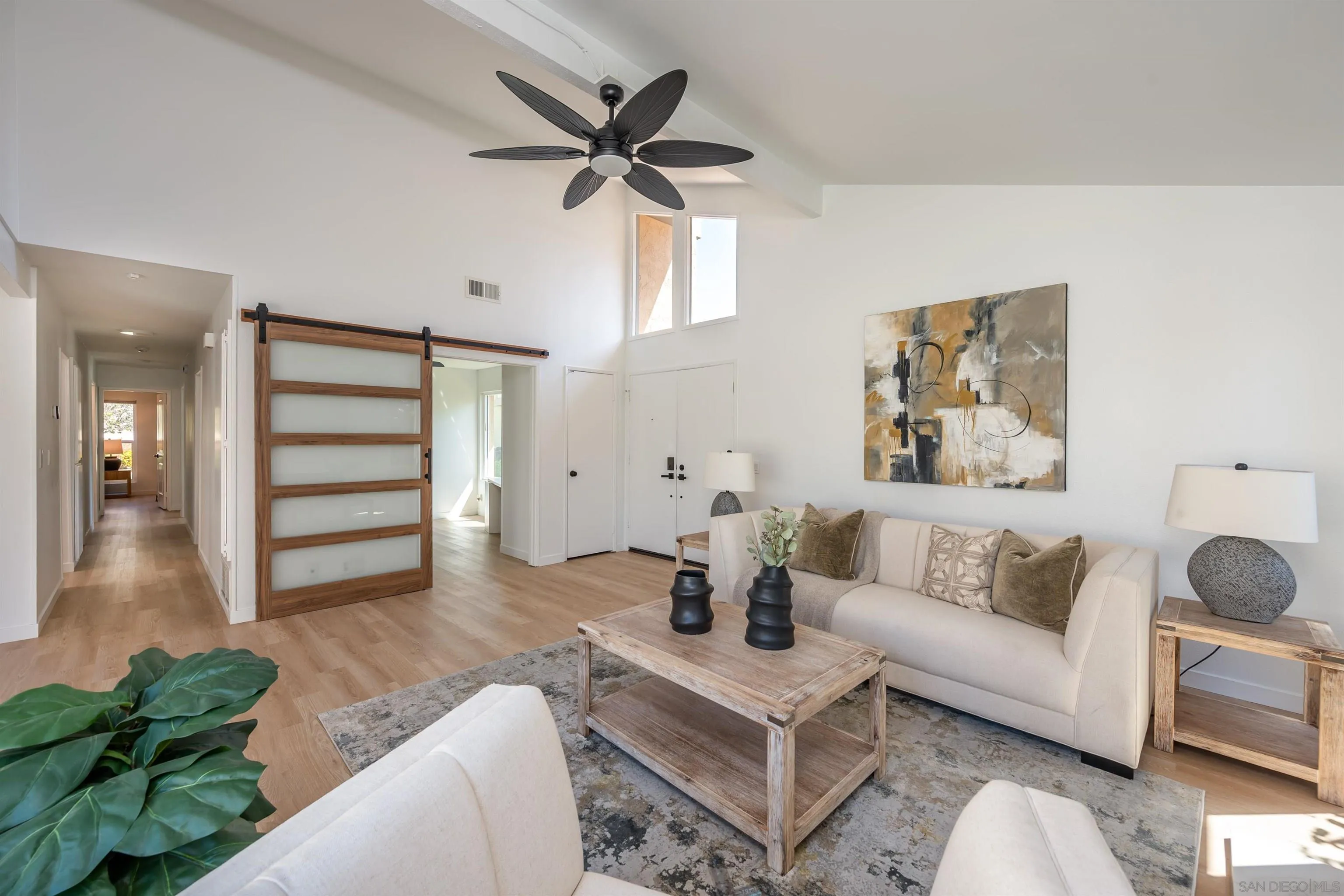 3577 Guava Way Oceanside, CA 92058 - Photo 5 of 42 a living room with furniture and a wooden floor