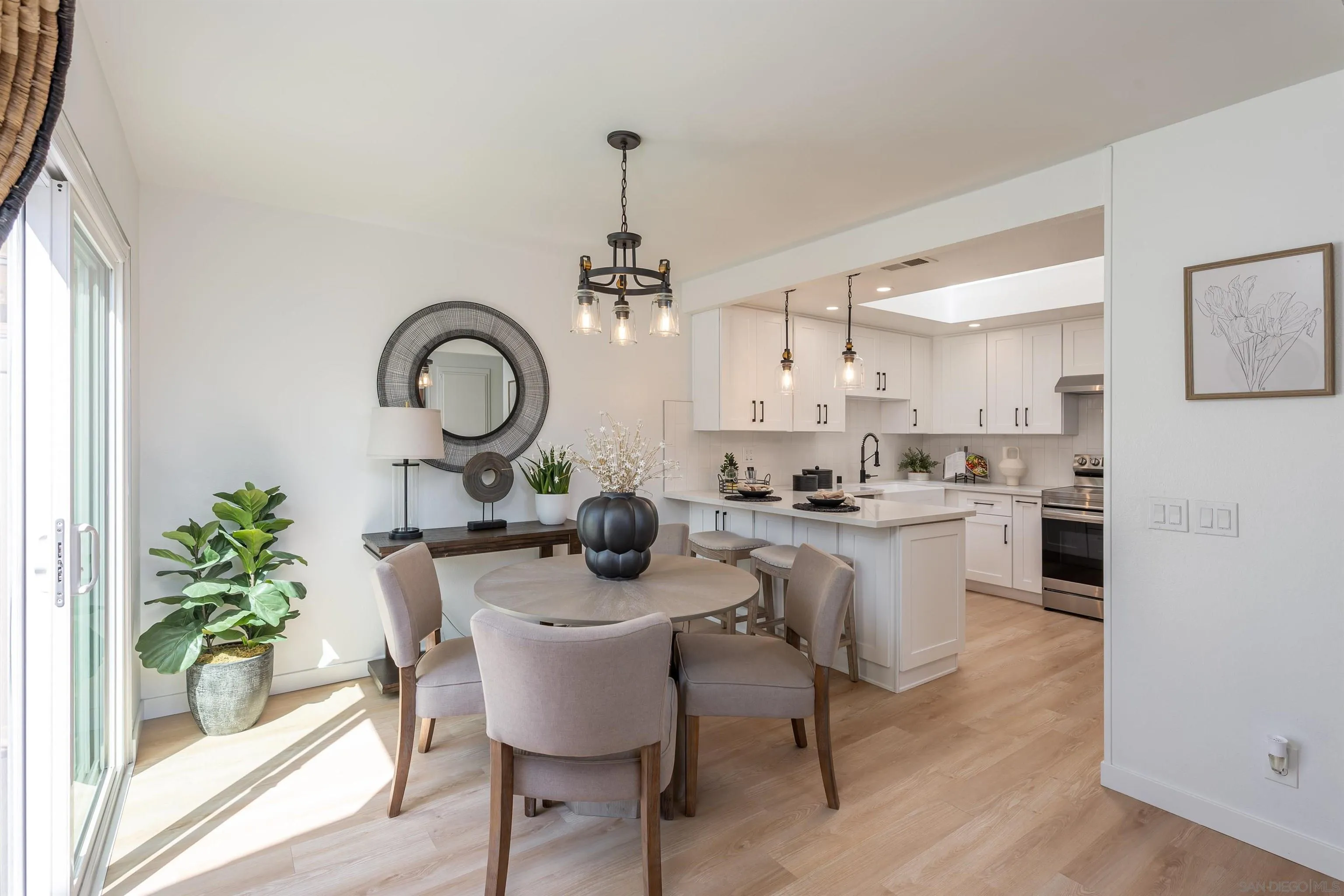 3577 Guava Way Oceanside, CA 92058 - Photo 6 of 42 a kitchen with a table and chairs in it