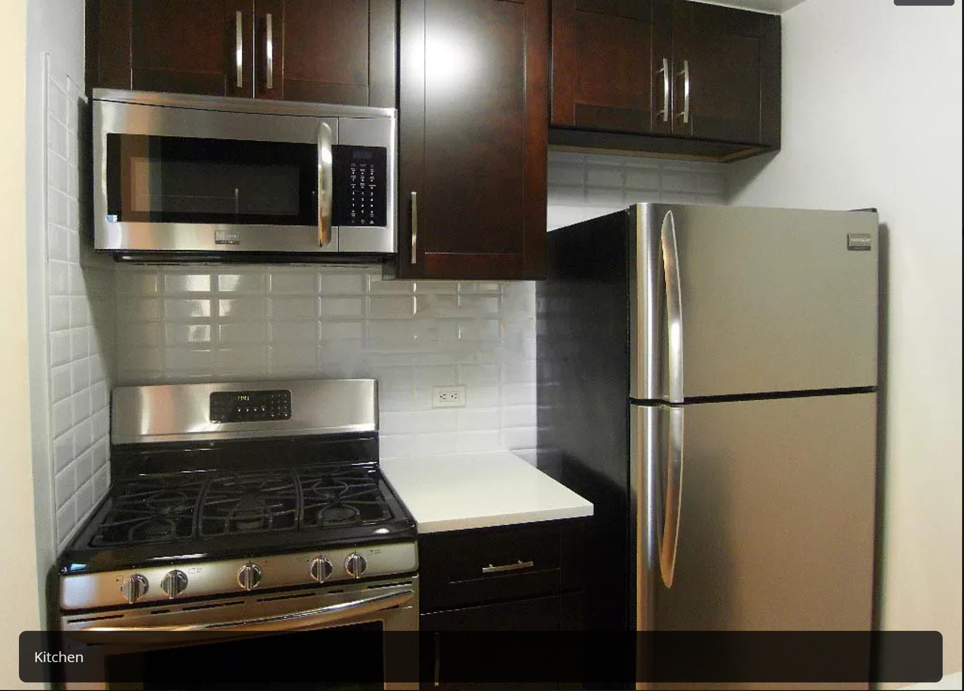 200 Rector Place, Unit 7V Manhattan, NY 10280 - Photo 3 of 8 a stove top oven sitting inside of a kitchen