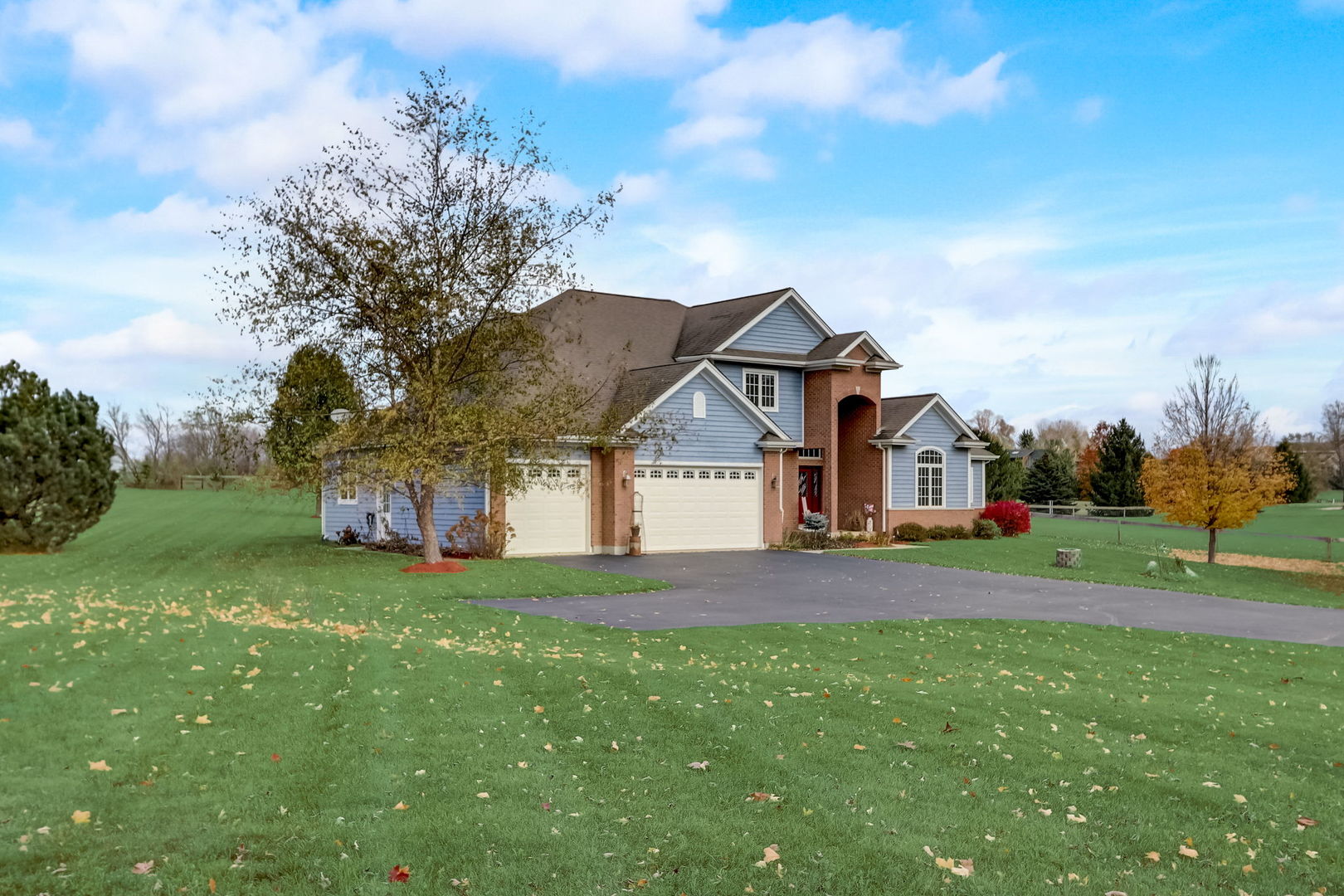 20818 Highview Road Marengo, IL 60152 - Photo 3 of 31 a front view of a house with a yard and garage