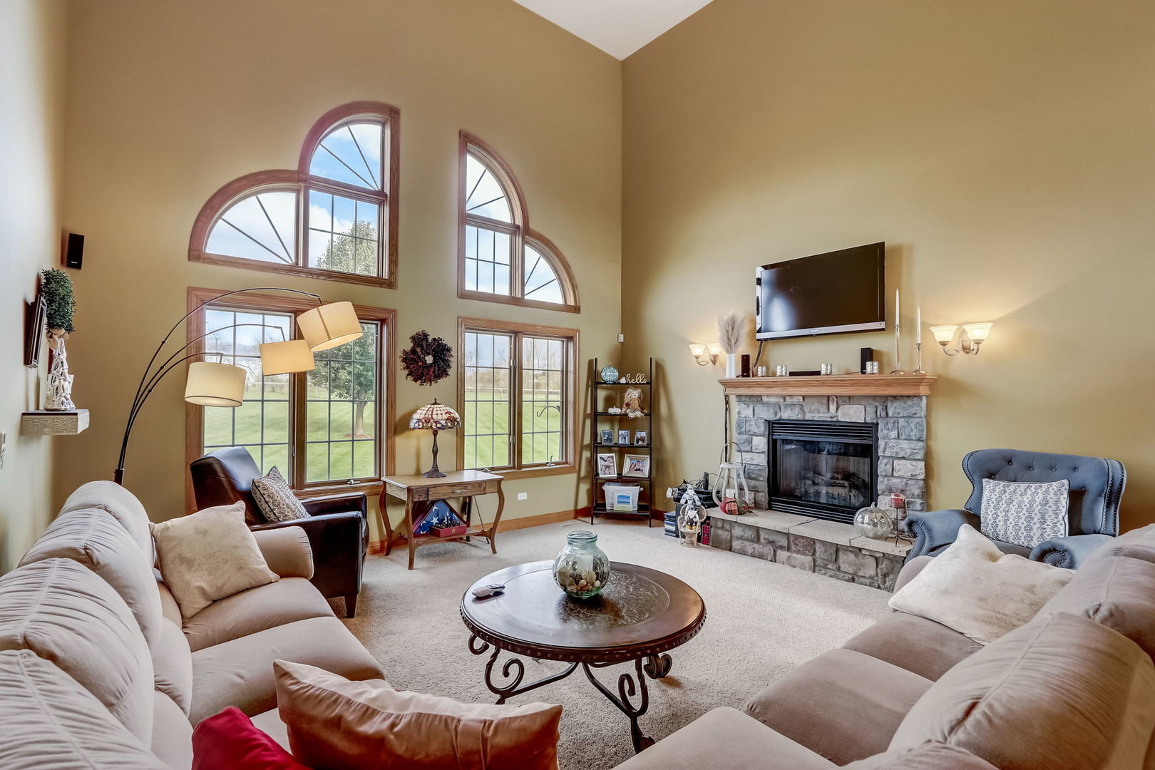 20818 Highview Road Marengo, IL 60152 - Photo 8 of 31 a living room with furniture a fireplace and a flat screen tv