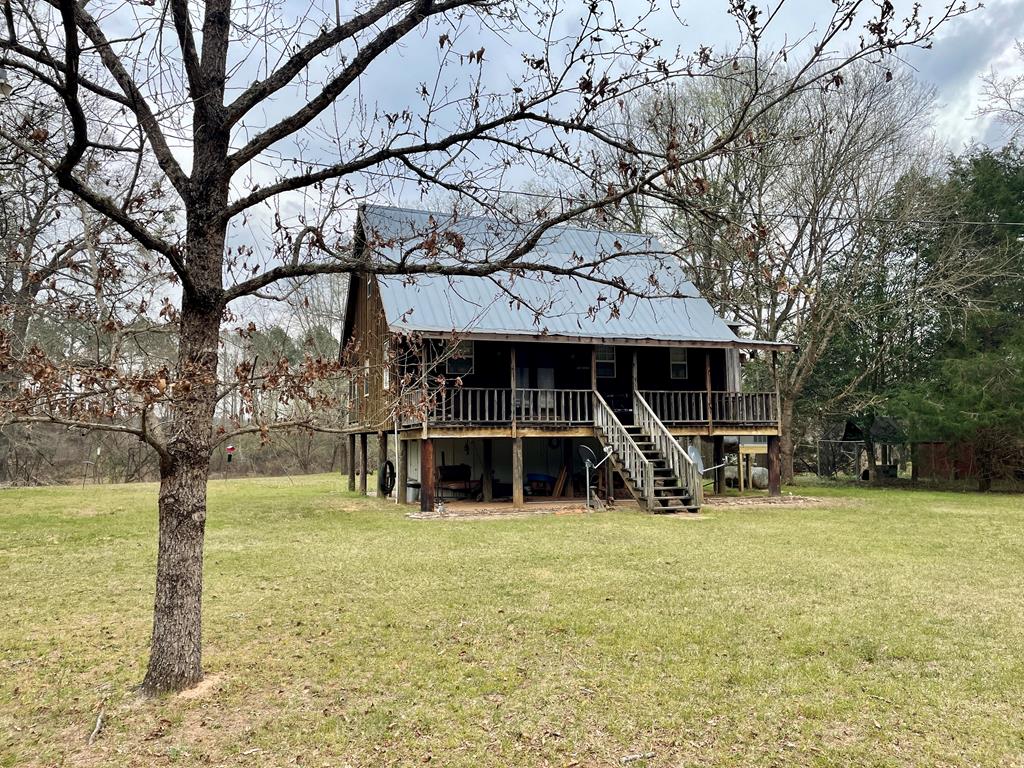 31 River Road Reynolds, GA 31076 - Photo 1 of 22 a view of a house with backyard porch and sitting area