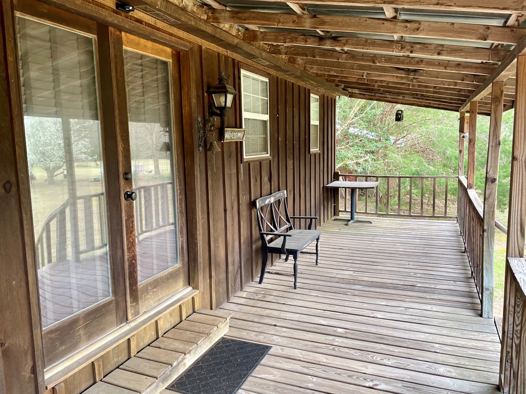 31 River Road Reynolds, GA 31076 - Photo 8 of 22 a view of a patio with a table and chairs