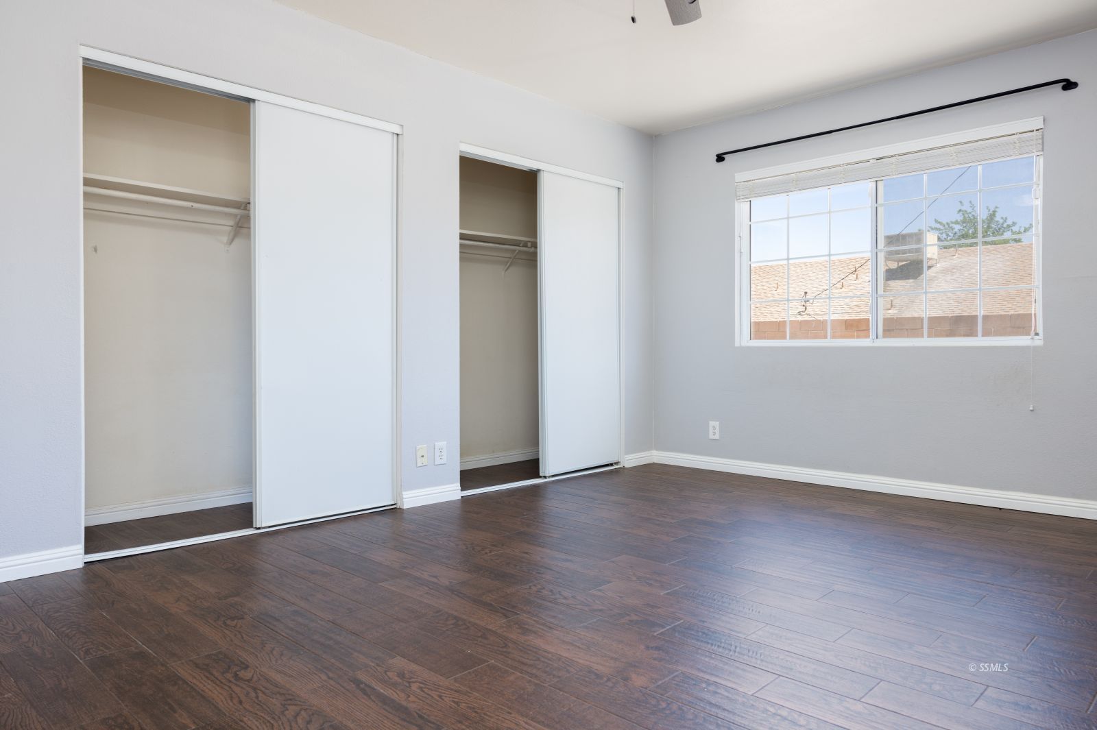 542 South Warner Street Ridgecrest, CA 93555 - Photo 24 of 33 an empty room with wooden floor and windows