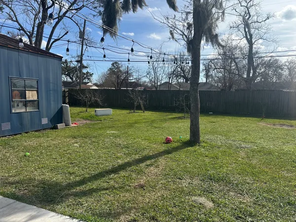 a view of a backyard with a small cabin