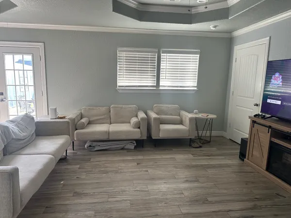 a living room with furniture and a fireplace
