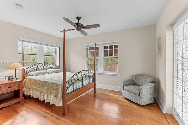 a bedroom with a bed and a couch