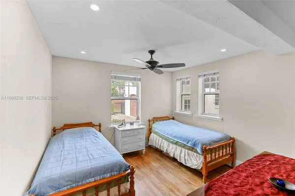 a bedroom with bed and window