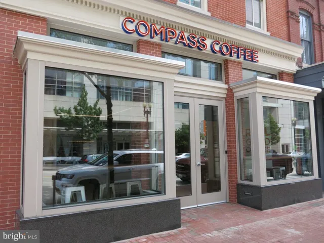 a table and chairs under an umbrella
