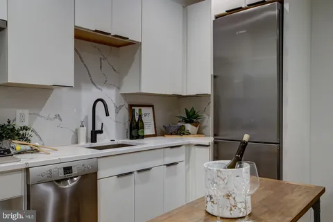 a kitchen with a sink and cabinets