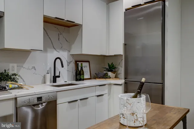 a kitchen with a sink and cabinets