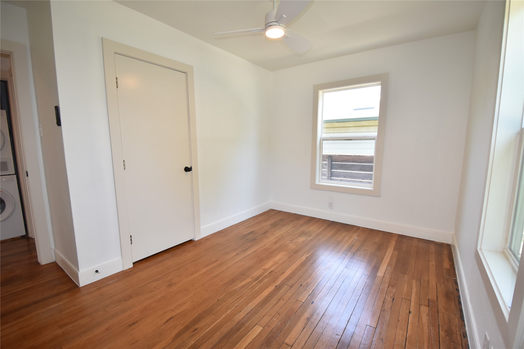 2012 Payne Avenue, Unit A Austin, TX 78757 - Photo 20 of 33 one of the two bedrooms with original wood flooring and natural light
