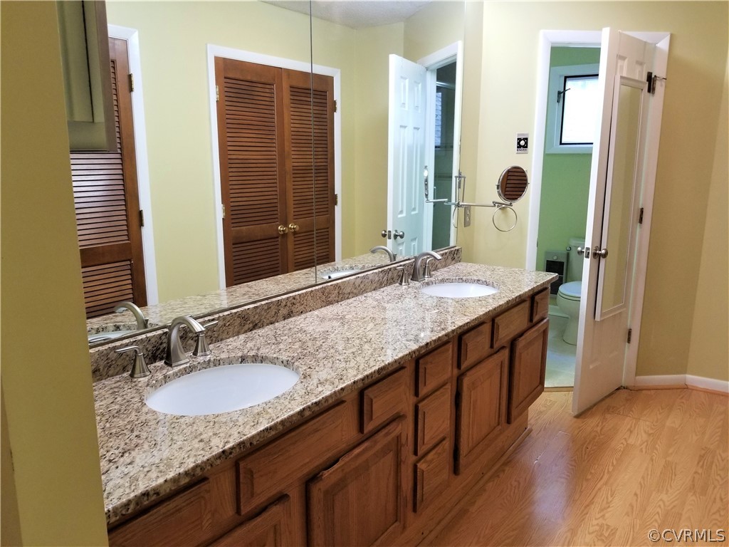 14301 Spring Gate Court Midlothian, VA 23112 - Photo 16 of 30 a bathroom with a granite countertop sink and a mirror