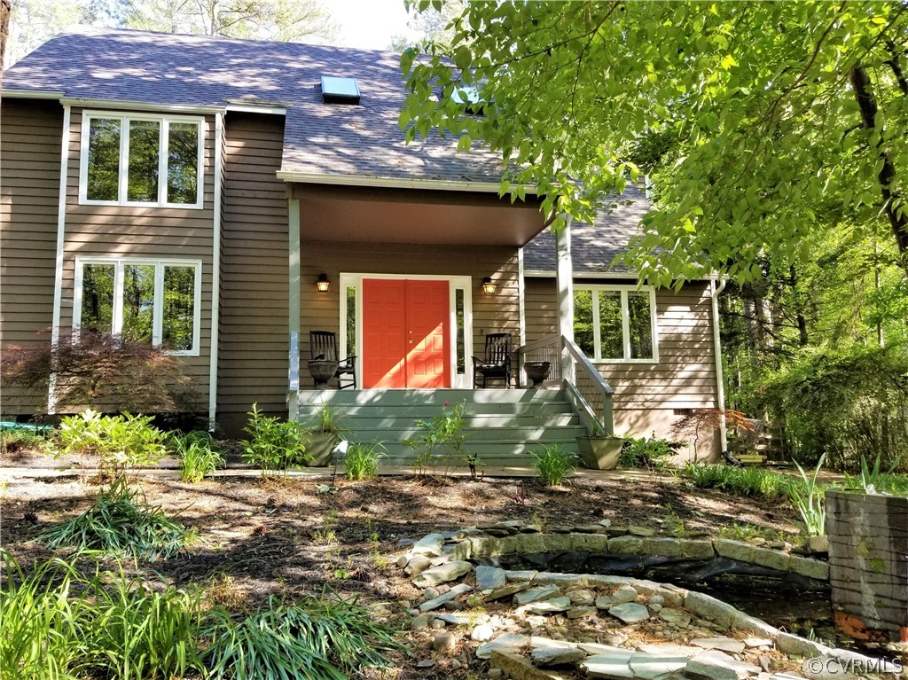 14301 Spring Gate Court Midlothian, VA 23112 - Photo 27 of 30 a front view of a house with garden