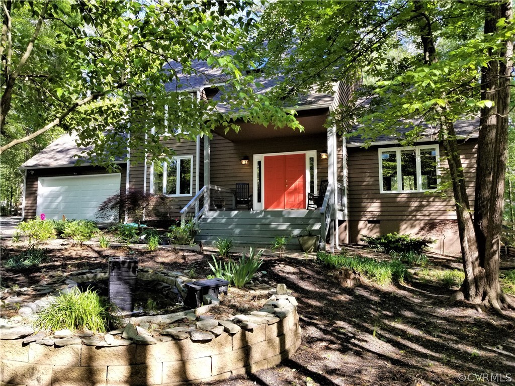 14301 Spring Gate Court Midlothian, VA 23112 - Photo 29 of 30 a front view of a house with garden
