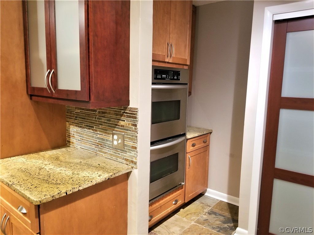 14301 Spring Gate Court Midlothian, VA 23112 - Photo 6 of 30 a kitchen with stainless steel appliances granite countertop a stove and a microwave