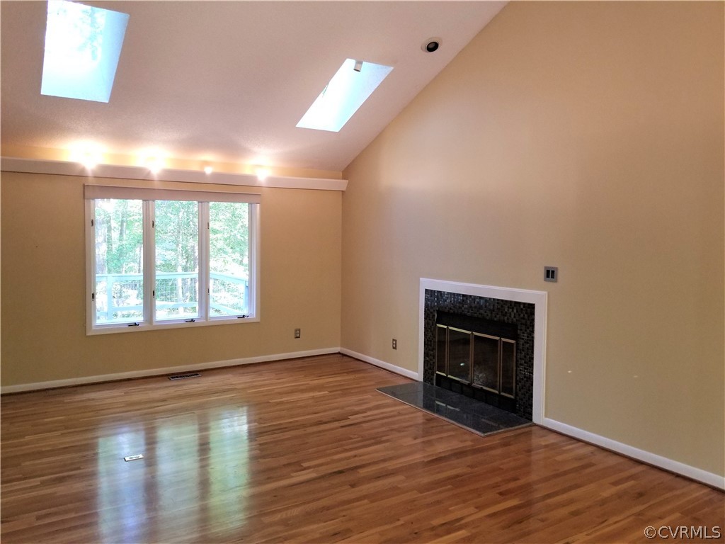 14301 Spring Gate Court Midlothian, VA 23112 - Photo 10 of 30 wooden floor fireplace and natural light in room