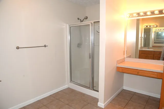 a bathroom with a sink and mirror