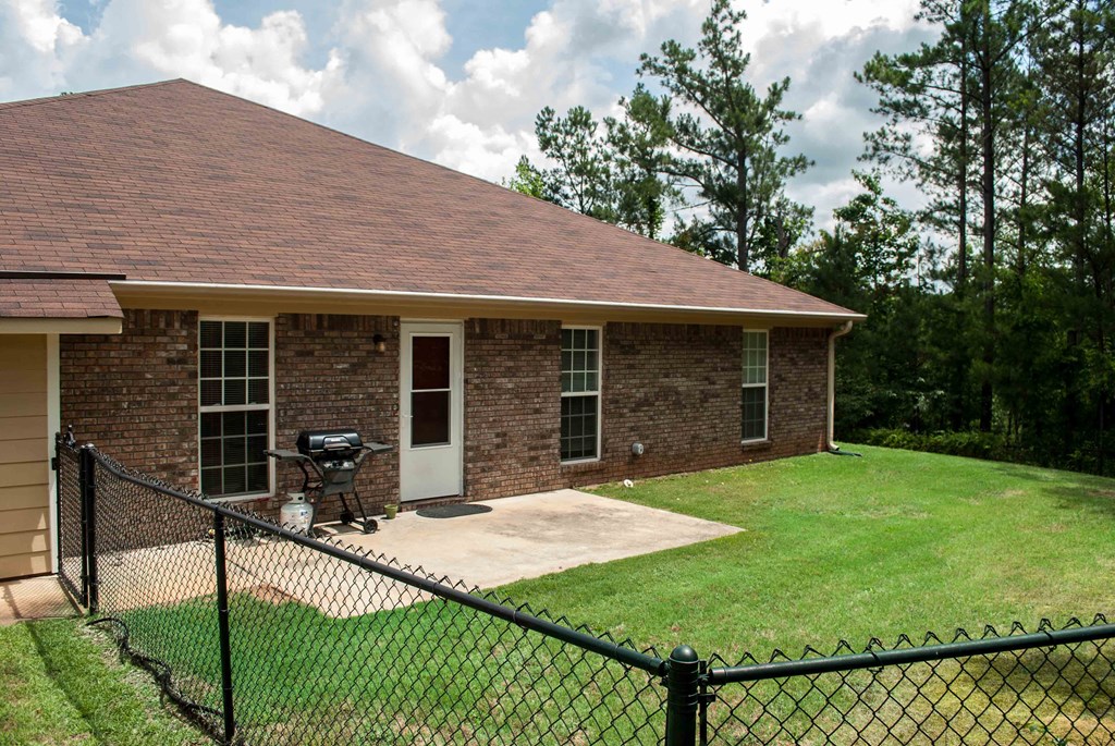 14 Kaitlyn Court Hamilton, GA 31811 - Photo 8 of 8 a front view of a house with garden