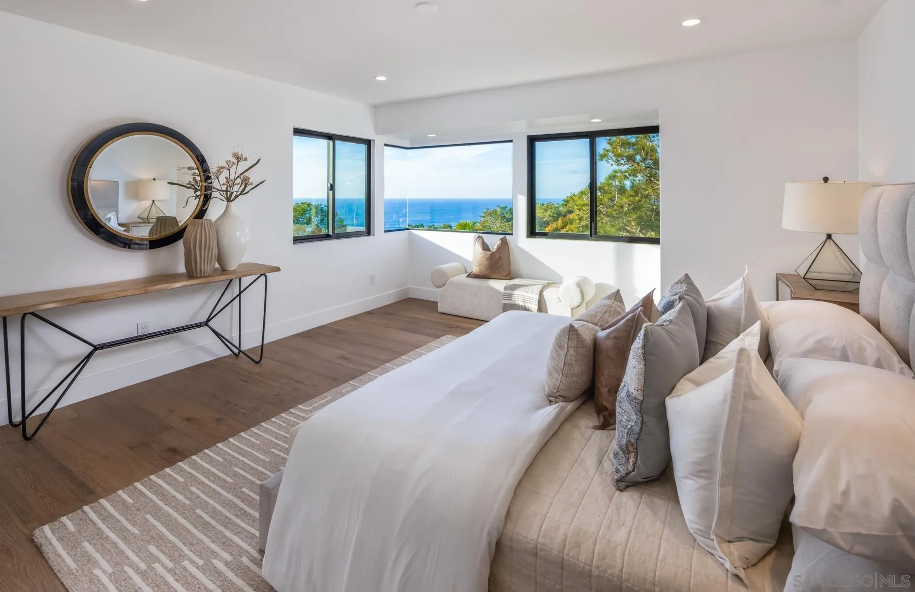 2144 Pinar Place Del Mar, CA 92014 - Photo 19 of 39 a bed room with a bed a mirror and a large window