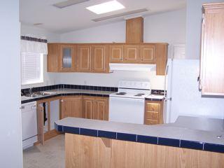 412 West Alpine Road Austin, TX 78704 - Photo 4 of 15 a kitchen with granite countertop a sink and a stove